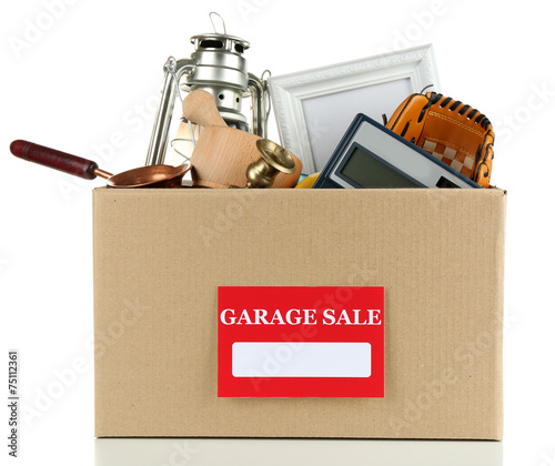 Box of unwanted stuff ready for a garage sale, isolated on