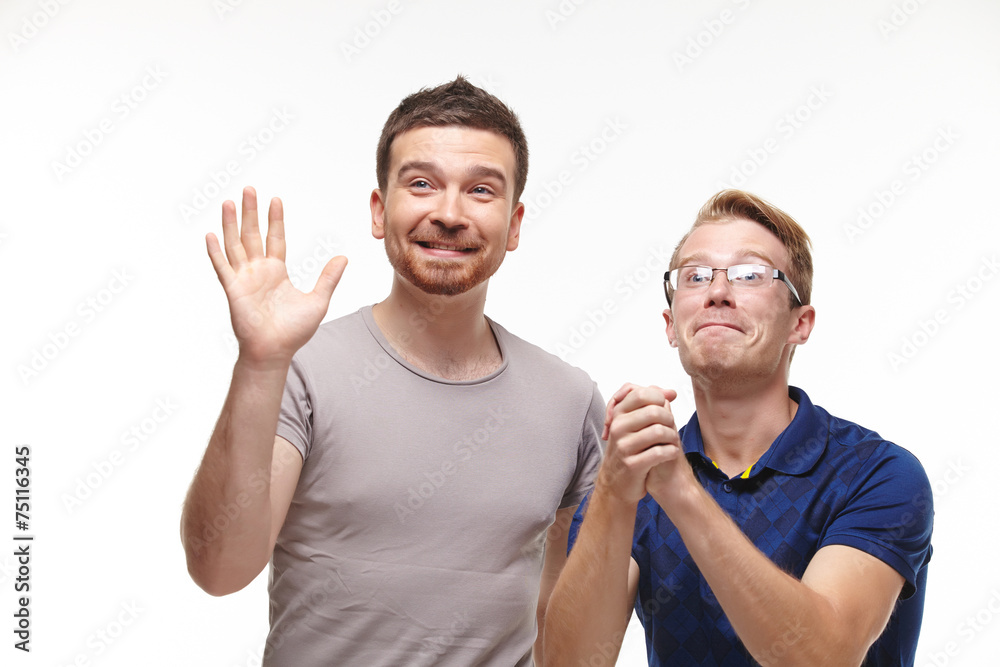 Two young men watching the competition