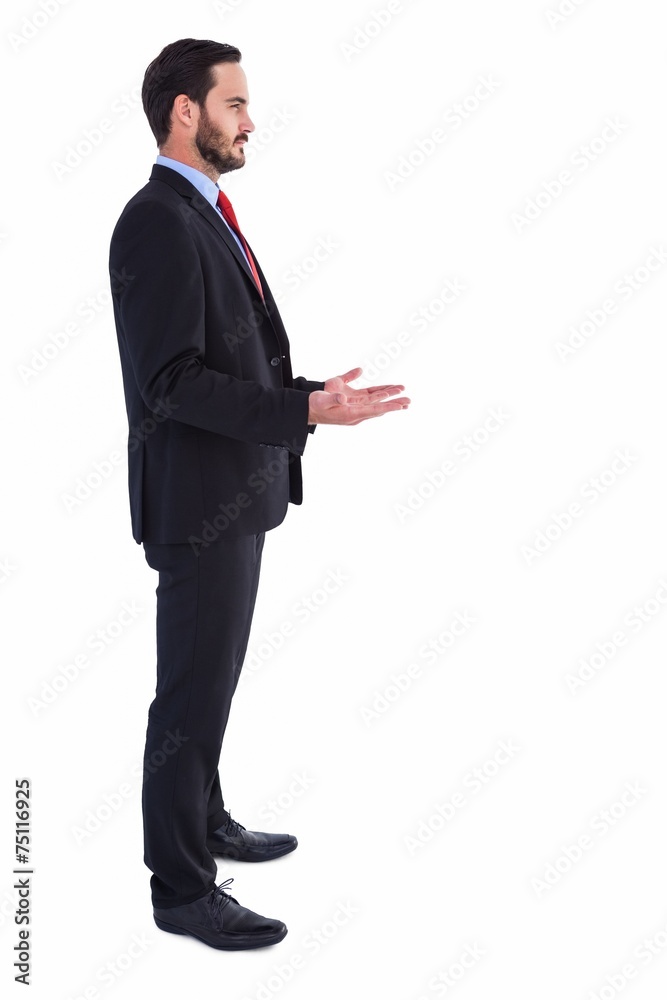 Frowning businessman presenting with hands Frowning businessman presenting with hands