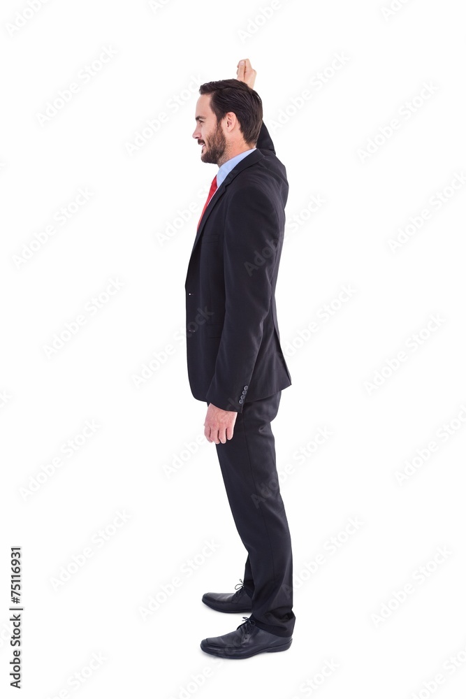 Smiling businessman standing with hand raised Smiling businessman standing with hand raised