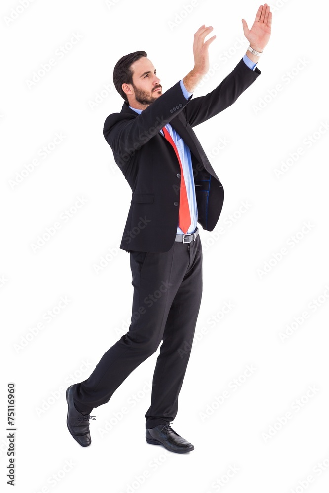 Serious businessman holding up with his hands Serious businessman holding up with his hands