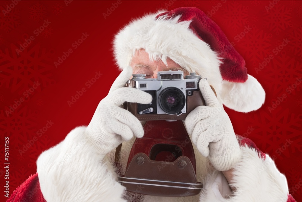 Composite image of santa is taking a picture Composite image of santa is taking a picture