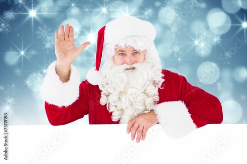 Composite image of portrait of santa claus waving