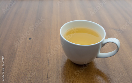 Cup of tea on wood board, drink for health