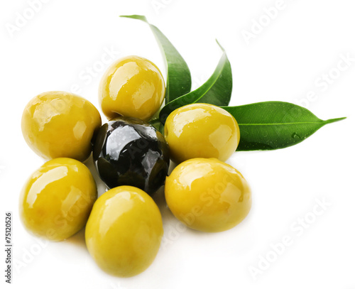 Green olives around black one with leaves isolated on white