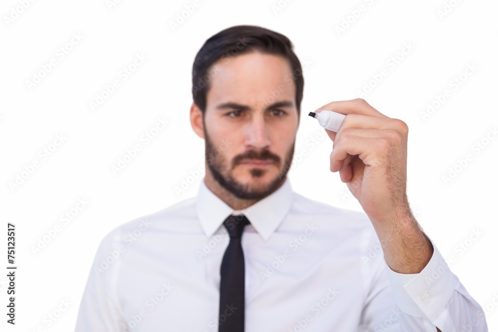 Focused businessman writing with marker Focused businessman writing with marker