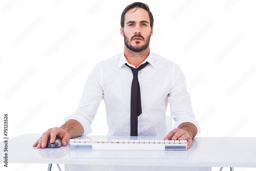 Focused businessman working on computer Focused businessman working on computer