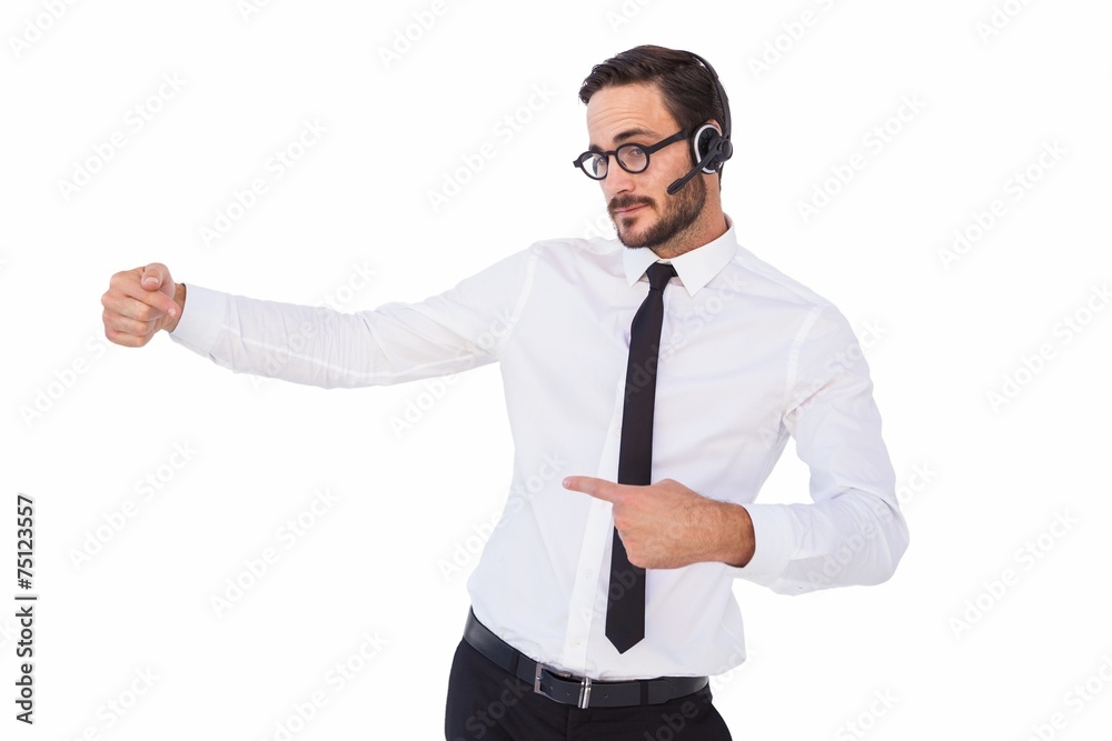 Businessman wearing a headset while showing something Businessman wearing a headset while showing something