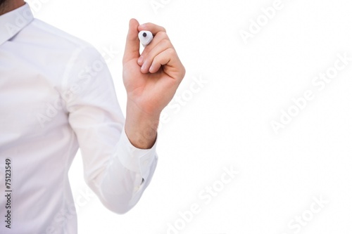 Mid section of businessman writing with marker