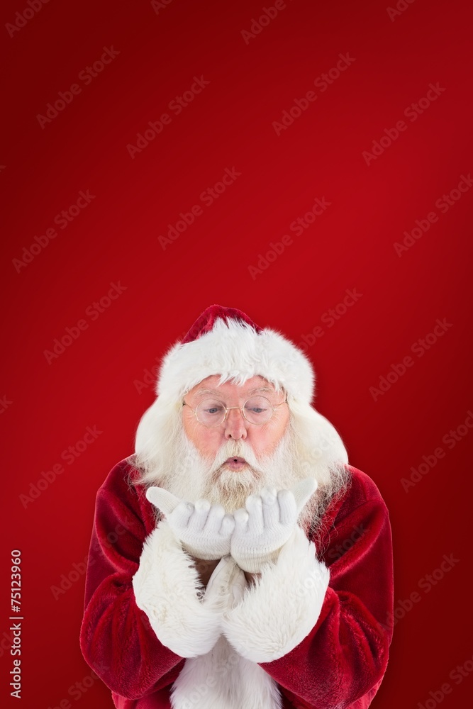 Composite image of santa claus blows something away