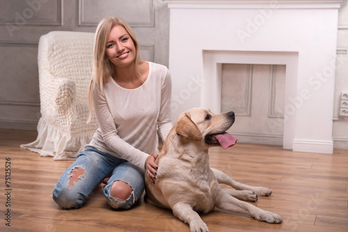Beautiful blond girl with Labrador Retriever