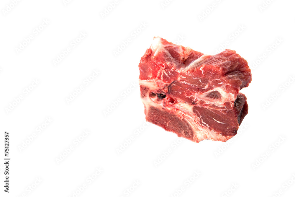 Chunk of cut frozen beef meat over white background Chunk of cut frozen beef meat over white background