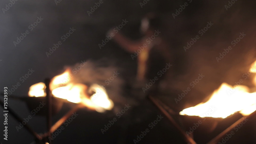 a woman does a fire performance