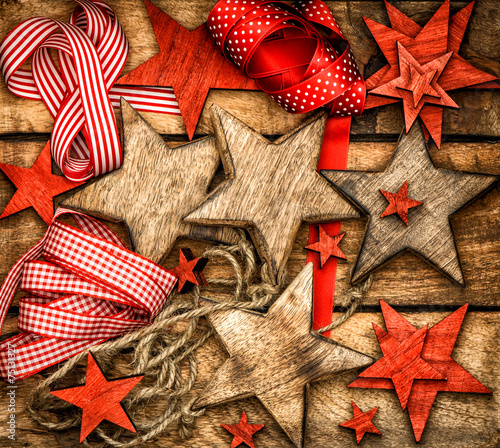 christmas decorations wooden stars and red ribbons photo