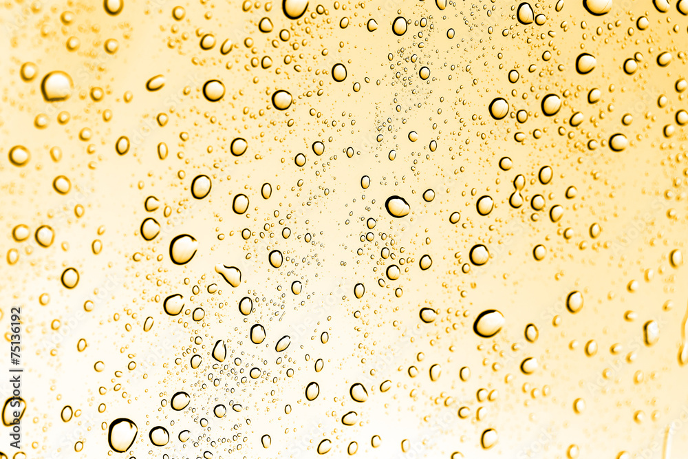 water drops on glass with gold water drops on glass with gold