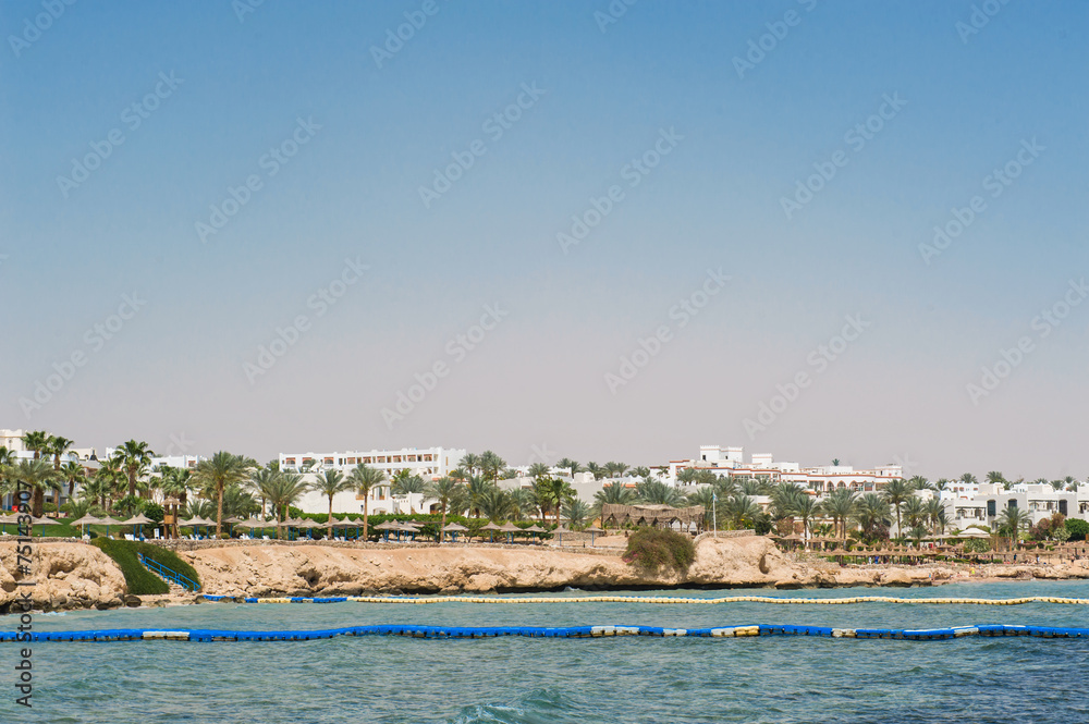 Panorama of white city and the blue sea with a coast line Sharm