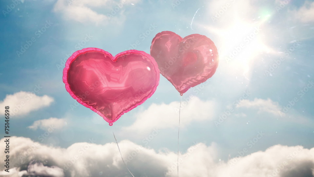Heart balloons floating against blue sky Heart balloons floating against blue sky
