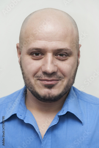 Young man portrait with bald head in blue shirt, id like photo
