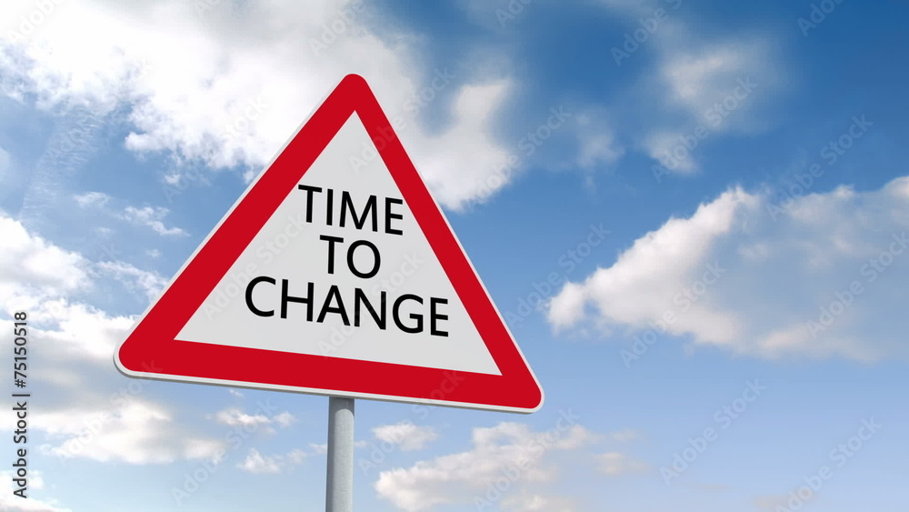 Time to change road sign over cloudy sky Time to change road sign over cloudy sky