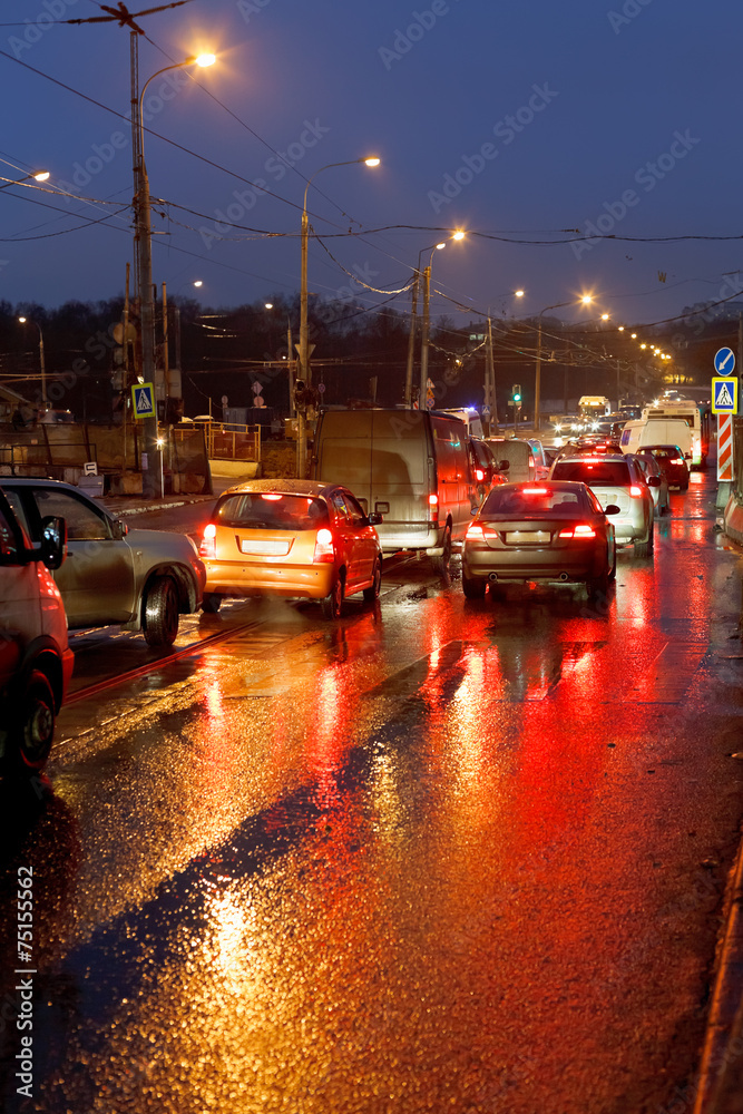 urban traffic in rainy evening urban traffic in rainy evening