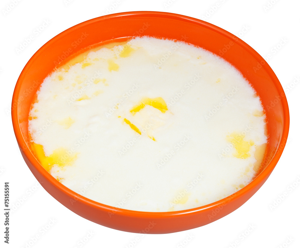 hot semolina porridge with butter in orange bowl hot semolina porridge with butter in orange bowl