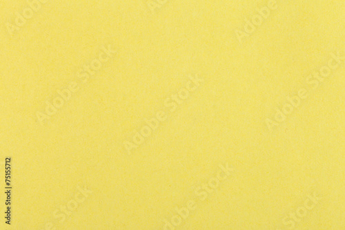 background from sheet of color yellow fiber paper photo