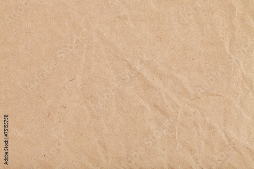 background from sheet of crumpled kraft paper photo