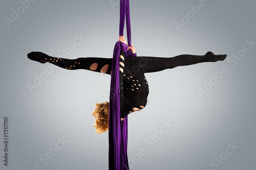 Beautiful dancer on aerial silk, aerial contortion