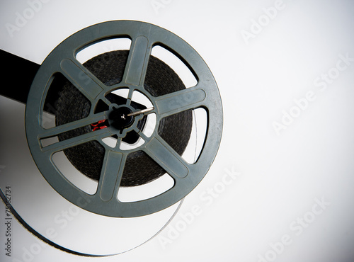Old fashioned movie reel on white background