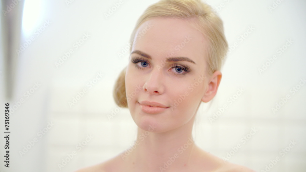 Portrait of beautiful young blond girl, she looking at camera Portrait of beautiful young blond girl, she looking at camera