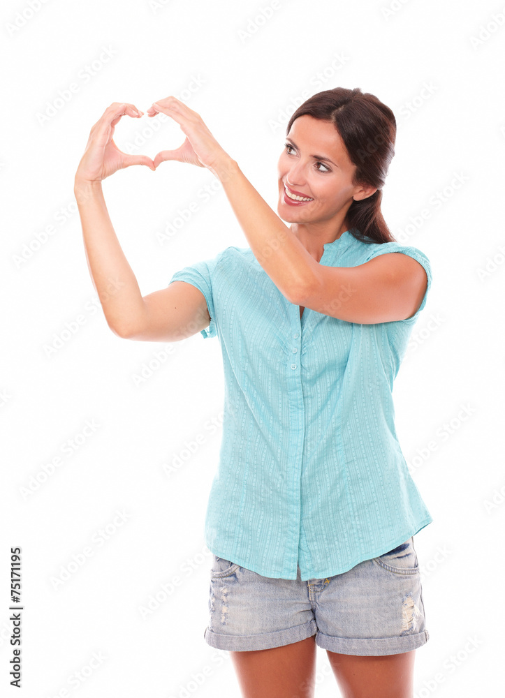 Pretty latin lady looking at a love sign Pretty latin lady looking at a love sign