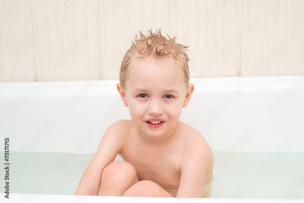 Little boy with wet soapy head isolated on white background Little boy with wet soapy head isolated on white background