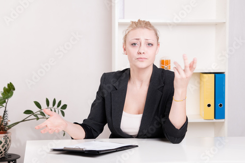 Fotografie Dissatisfied employer woman during interview at office