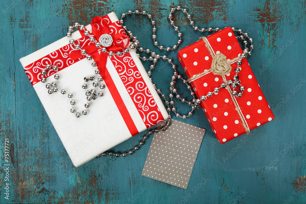 Fototapeta premium Gift boxes with card on wooden background