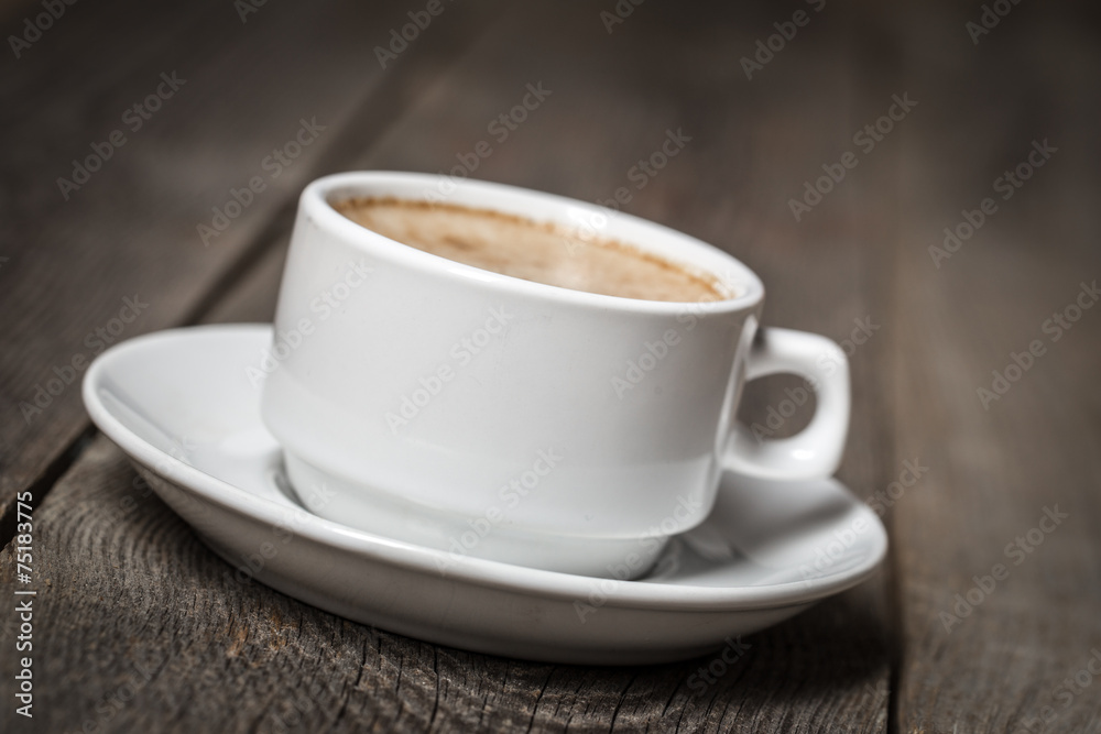White coffee cup on wooden table
