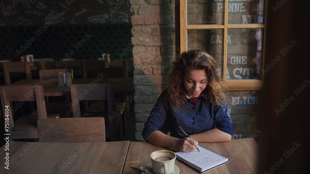 Young woman working or study in a cafe Young woman working or study in a cafe