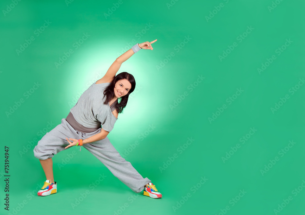 Attractive young female in stretching over green Attractive young female in stretching over green