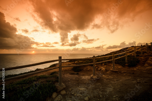 Wooden fence on the edge of Europe. Sunset. tinted
