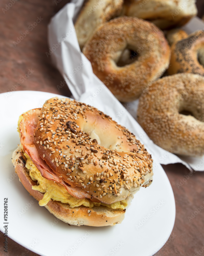 New York style breakfast bagel with scrambled eggs and ham