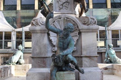 "A man killing a fish" statue in Innsbruck, Austria