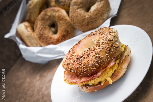 New York style breakfast bagel with scrambled eggs and ham