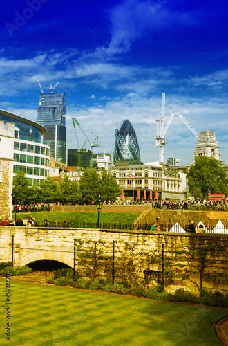 Gardens of Tower of London with city skyline on background photo