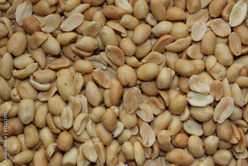Scattered roasted and salted peanuts Scattered roasted and salted peanuts