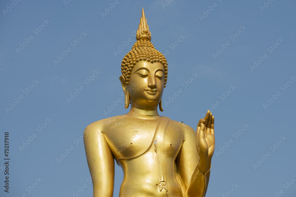 Standing golden buddha statue Tak , Thailand
