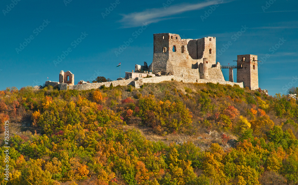 Nice autumnal scene with the ruins of the castle of Csesznek