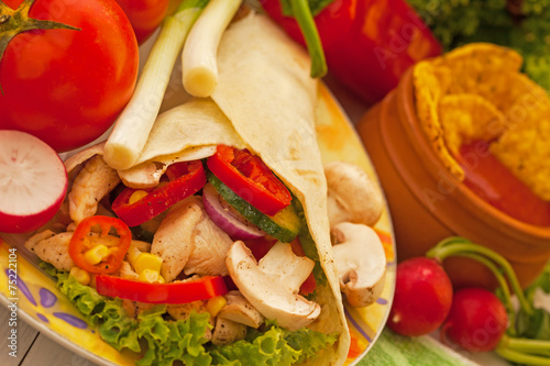 Fresh burito with chicken and tomato