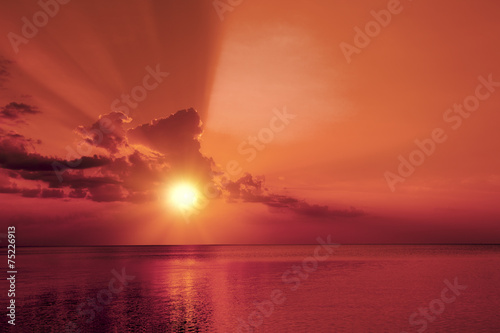 Magic marsala sunrise over sea