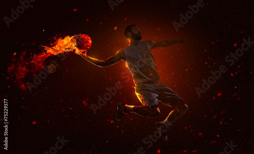Professional basketball player with fireball
