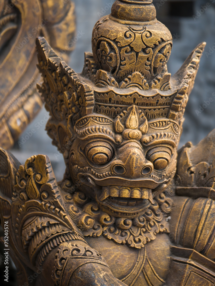 Fototapeta premium Gardian statue at the Bali temple entrance