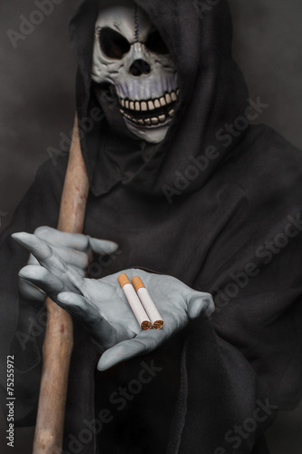 The concept: smoking kills. Grim reaper holding cigarette